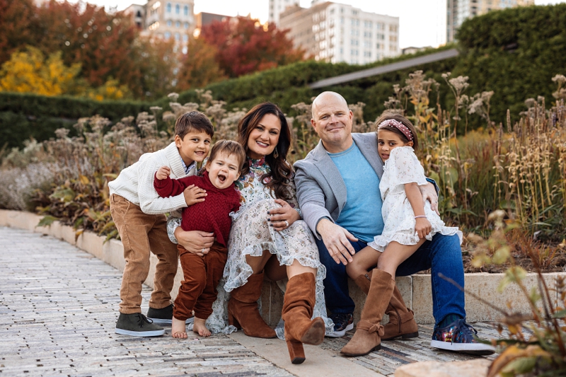 a family sits together in Chicago's lurie gardens
