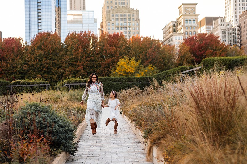 Lurie Gardens family photos in Chicago with city skyline and natural greenery backdrop