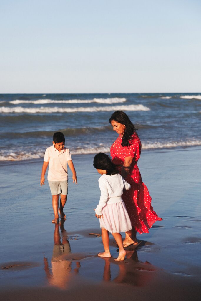 mom with her kids on the beach