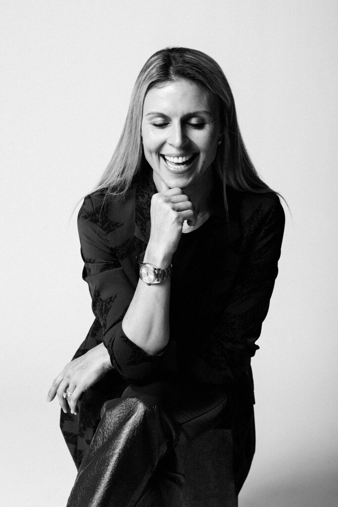 woman laughing in a black and white portrait
