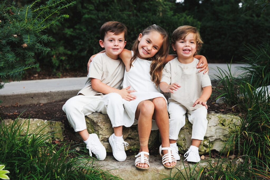 kids in a white and tan outfits