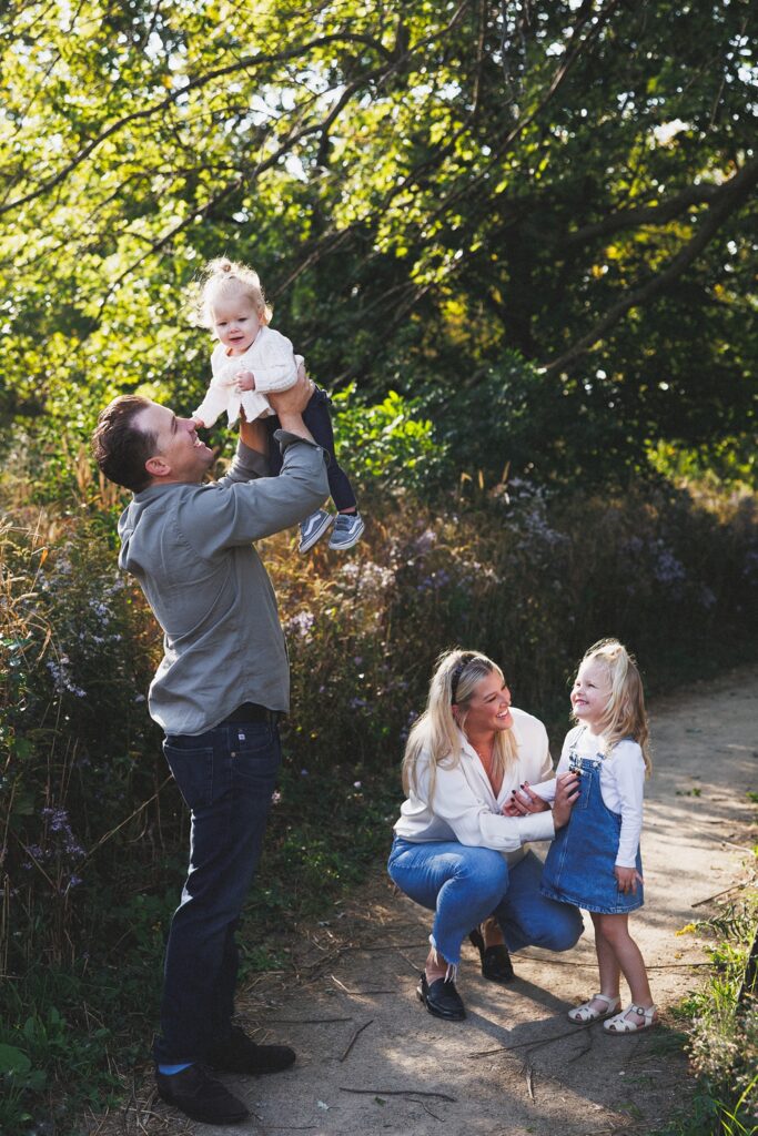 a family in coordinated outfits for their fall family photos