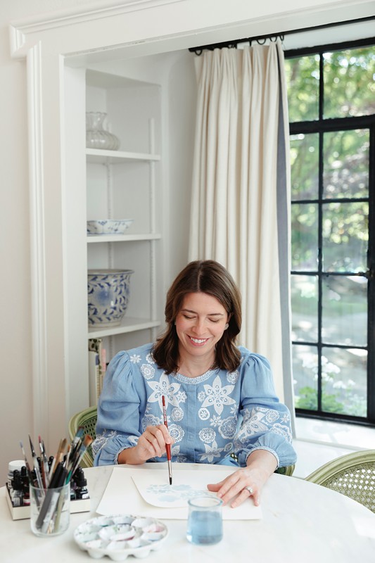 artists paige spearin paints with her watercolors in her home