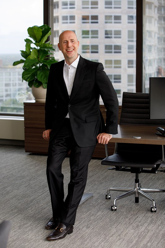 an executive poses for a portrait in an office