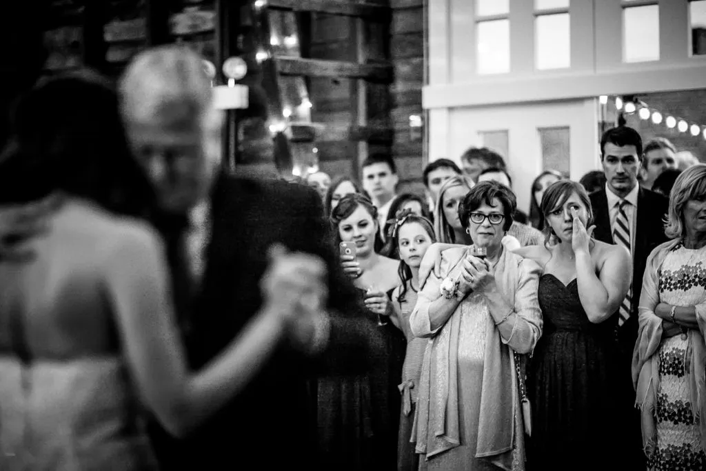 mother watches brother-in-law dance with daughter