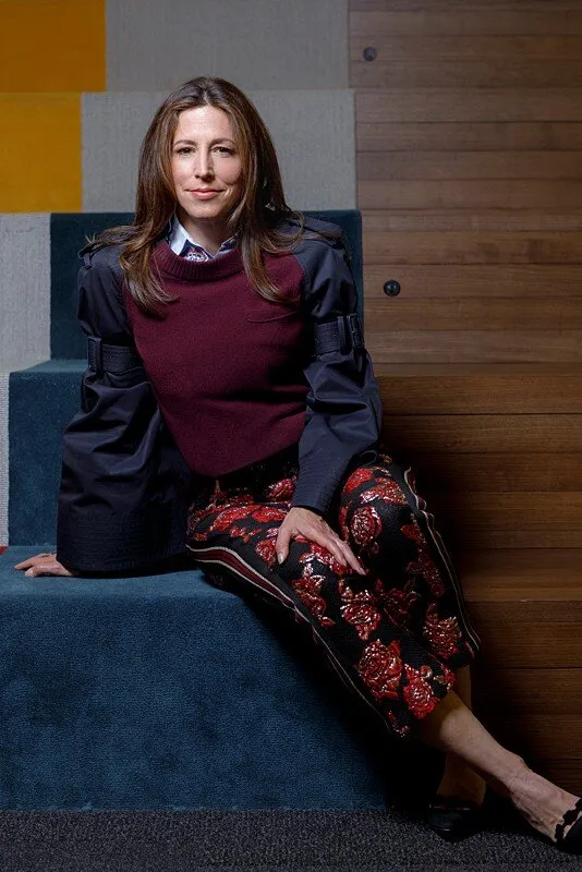 Peak 6 Owner Jenny Just poses for a corporate portrait on the steps of her 5th floor trading financial tech trading firm.