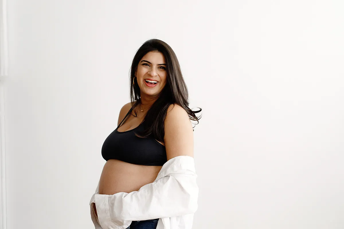 mom in white button down and black sports bra