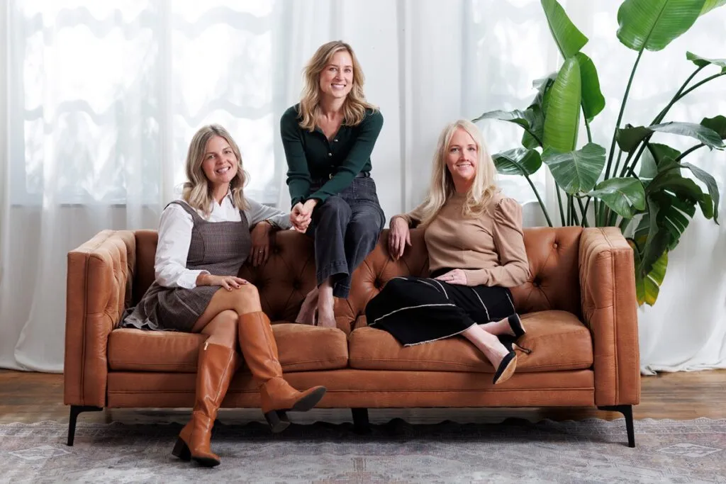 realtor jennefer folsom and others on a couch in chicago