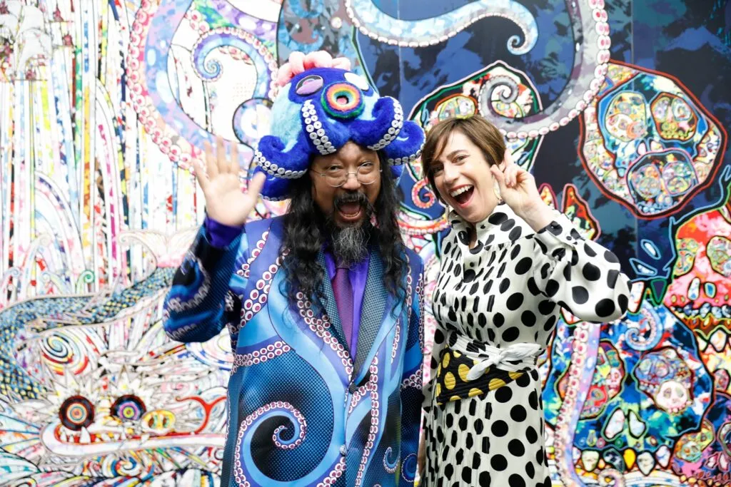 a guest poses with the artist murakami at the Museum of contemporary art's 50th anniversary in chicago